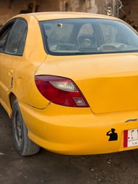 كيا ريو ٢٠٠٢ سنوية لل٢٧. رقم بغداد الماني شرط تحويل  داخل حلو صدر جديد...