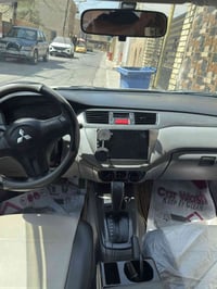 لانسر مديل 2007 اباسمي محرك جديد 2000  صدر امامي خلفي جديد تبريد ثلج  ...