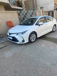 كورلا 2025 هايبرد رقم بغداد فول مواصفات  ماشية ٢٥٠٠ كم وقابل للزيادة ت...