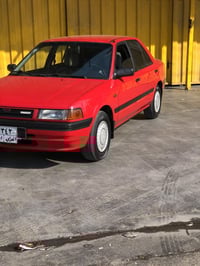 مازدا ٣٢٣ )١٩٩٠)٨وبه خ سبوغ بيلادي 07728001944