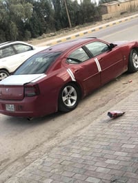 عندي جارجر 2010 رقم اربيل نكليزي 97وبيه مجال بيع او مراوس 07814305484