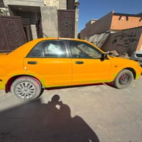 مازدا ياباني موديل 2002 المكينه المرغوبه قطاره بصرف البانزين رقم كركوك...