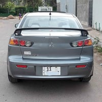 لانسر ٢٠١٦ • ماشيه ٤٥٠٠٠ • رقم بغداد باسمي