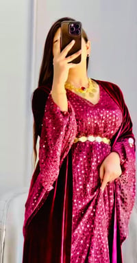 ملابس • مش واضح