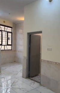 دار ٥٠م • طابق ونص مسلح • كربلاء الجاير