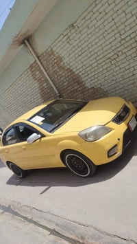 كيا ريو موديل 2010 وارد امريكي  ضرر جاملغ امامي جه النفر والبوند وملاح...