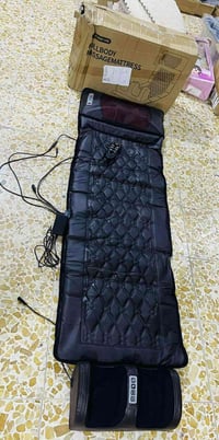 جهاز تدليك • مساج