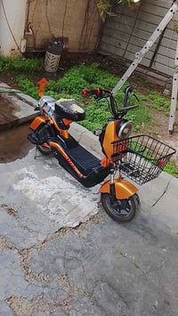دراجه شحن حجم 14 للبيع لون مشمشي سرعه 45 فول مواصفات بطاريه نص عمر درا...