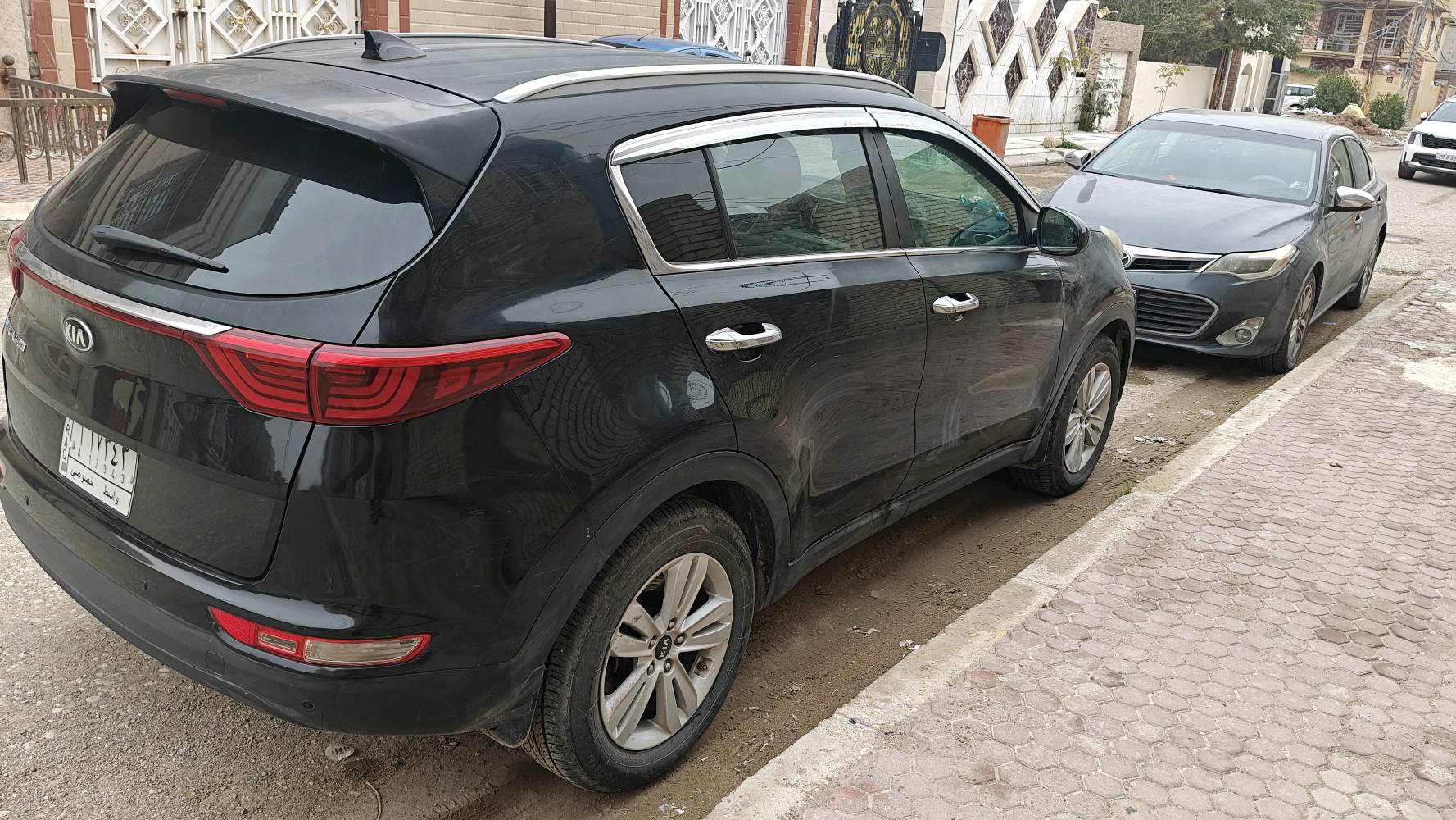 كيا سبورتج وارد امريكي ضرر باب لون اسود رقم واسط