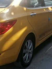 اكسنت ٢٠١٢ بسمي رقم بغداد سياره جاهزة امريكي مكينة ١٦٠٠ مصفرة هيئة غرا...