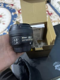 عدسه نيكون 50ملم ثابت بعدهي بل كارتون ما مستخدمه  سعر 300 تواصل 078700...