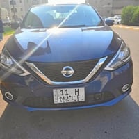 نيسان سنترا 2018 فئة sr  رقم بغداد دولي-هزة جديدة- كير محرك 1800 تبريد...