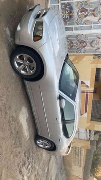 جارجر 2010 مكينه تلاثه ونص  تخم تاير جديد ويل كروم حداديه وسط سياره جا...