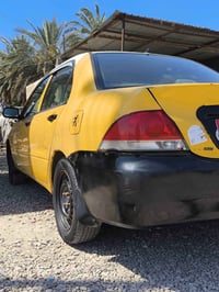 سياره لانسر 2010للبيع للاستفسار 07735655300