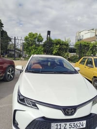 كورلا هايبرد ٢٠٢٥ للبيع مكفولة من صبغ وبارد ماشيه٢١ بسمي سياره مكان ال...