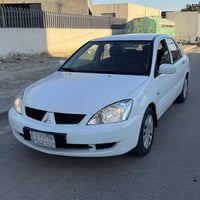 لانسر 2010 السلام عليكم لانسر موديل 2010 استلام شركة رقم كربلاء  بيها ...