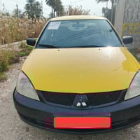 للبيع لانسر  2010 مكينه 1600 مصبوغه حزام ضربته بل جنطه خفيفه رقم بغداد...