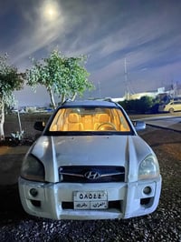 هيونداي تكسون موديل ٢٠١٠ محرك و كير و تبريد و تدفئة بشرط  كير توماتيك/...