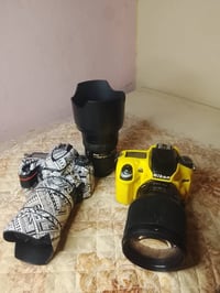 كامرات ثنين وتريكر نيكون لمس  وعدسات 4 الكامره الصفره 610فول فريم بعد ...