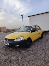 لانسر ٢٠١٠ • كير عادي • ما بيها نقص