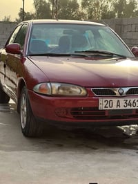 بروتون 2003  رقم دولي محرك لاصرف ولاتبخير سياره جاهزه بيها جملغ امامي ...