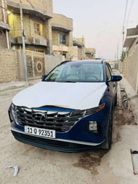 سيارتي توسان ازرق 2023 وارد امريكي رقم بغداد انگليزي  ماشية 25 الف ميل...