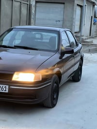 اوپل فكترا موديل 1991محرك 18رقم سنويه جديد بيه دفتر بنزين سياره كلشي 0...