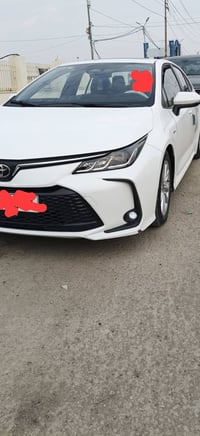 كورلا هايبرد موديل 2024 فول مواصفات فتحة بصمه رادار امامي شاشه تحكم ست...