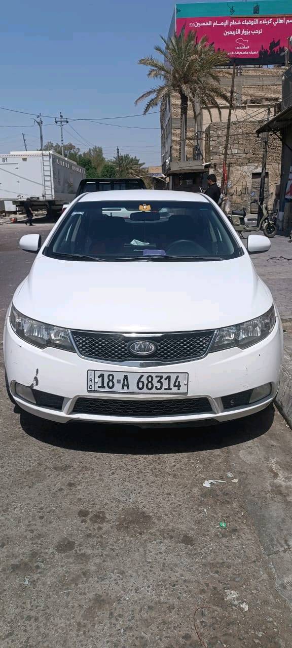 سياره سيراتوا موديل ٢٠١٢ رقم بابل ٣قطع اللون ابيض