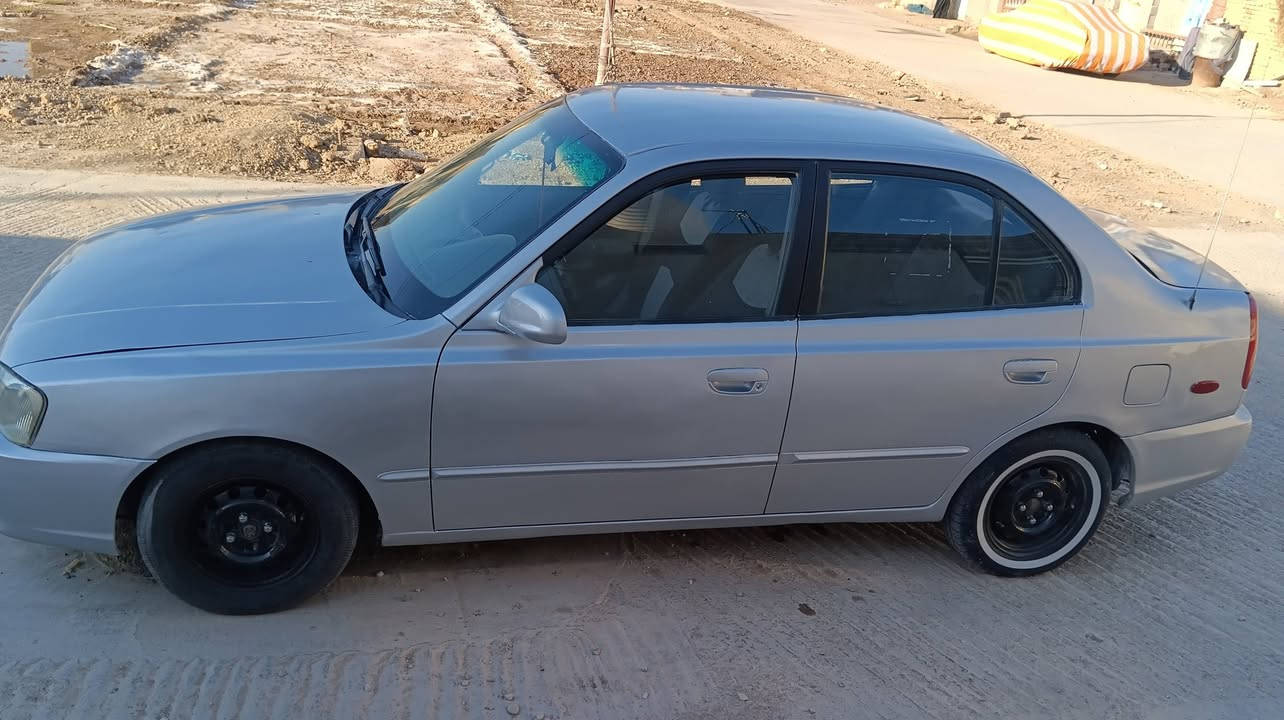 سلام عليكم اكسنت افيرنه موديل 2001  مصبوغة عام بدون ضربة محرك 1600 رقم بغداد انكليزي باقي ع استلام لوحات تبريد عوزة بس قايش السيارة وارد امريكي بدون ضرر ليبل واحد كلهة سيارة جاهزة  السيارة  بلكوت موجودة  ***********اتصل ع الرقم
