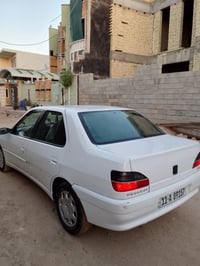بيجو ٢٠٠١ • رقم بغداد • كير عادي