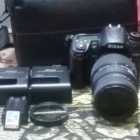 نيكون D7000 • عدسة 70-300 • شنطة وحزام