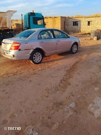 جيلي موبل ٢٠١٣ كفاله عامه فقط المحرك بيه خيط بخار  وخياسات بالهلال الخ...