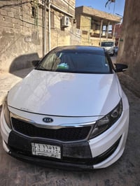 اوبتيما • ٢٠١٣ • بصمه وكشن جلد