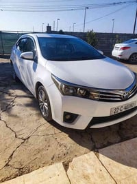 كورلا ٢٠١٥ اريدها معارض مع النترا وفرق السعر اريد 07510273414