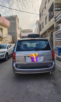 دوج كرفان فئة كرو بدون فتحه موديل 2013 رقم بغداد  7 راكب  شاشه اعطال ا...