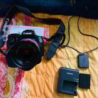 كانون 3100D • بطاريتين • شاحن أصلي