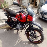 دراجة بوكسر موديل 2022 لون احمر مرقم بغداد دولي لوحات عدد (٢) ماشية (٢...