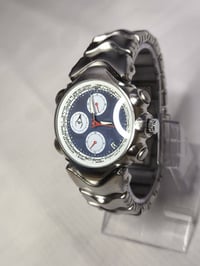 أوكلي • تيتانيوم • كوارتز