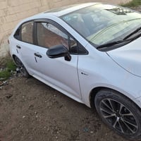 تويوتا كورلا ٢٠٢٤ هايبرد رقم بغداد شكل الأمريكي  ماشيه ٣٧٠٠٠ الف  سايد...