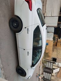 نيسان سني  موديل 18 رقم بغداد نكليزي  سياره بسمي كلشي كدامك واضح سونار...