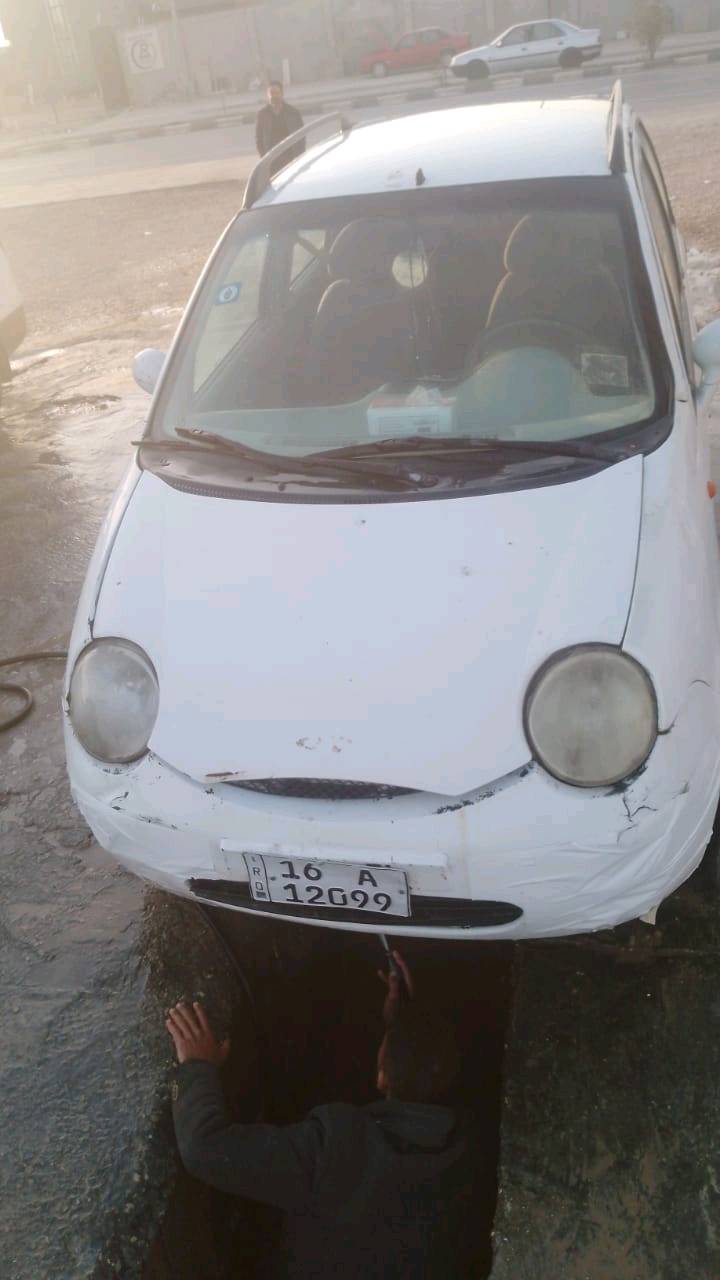 سيارة كيو كيو صاحبها نجف رقم انكليزي بيها ضربات خفيفه صور كما موضح في الاعلى بيها مجال بسيط مستعجله على بيعتها 