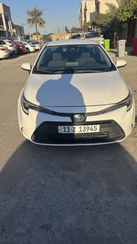 كورولا هايبرد موديل 2023 واريد امريكي لون ابيض رقم بغداد بأسمي فئة LE ...