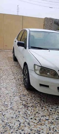 لانسر 2002 رقم بغداد مجدده ل30 السياره نضيفه وحلوه بلاديه السونار مراف...