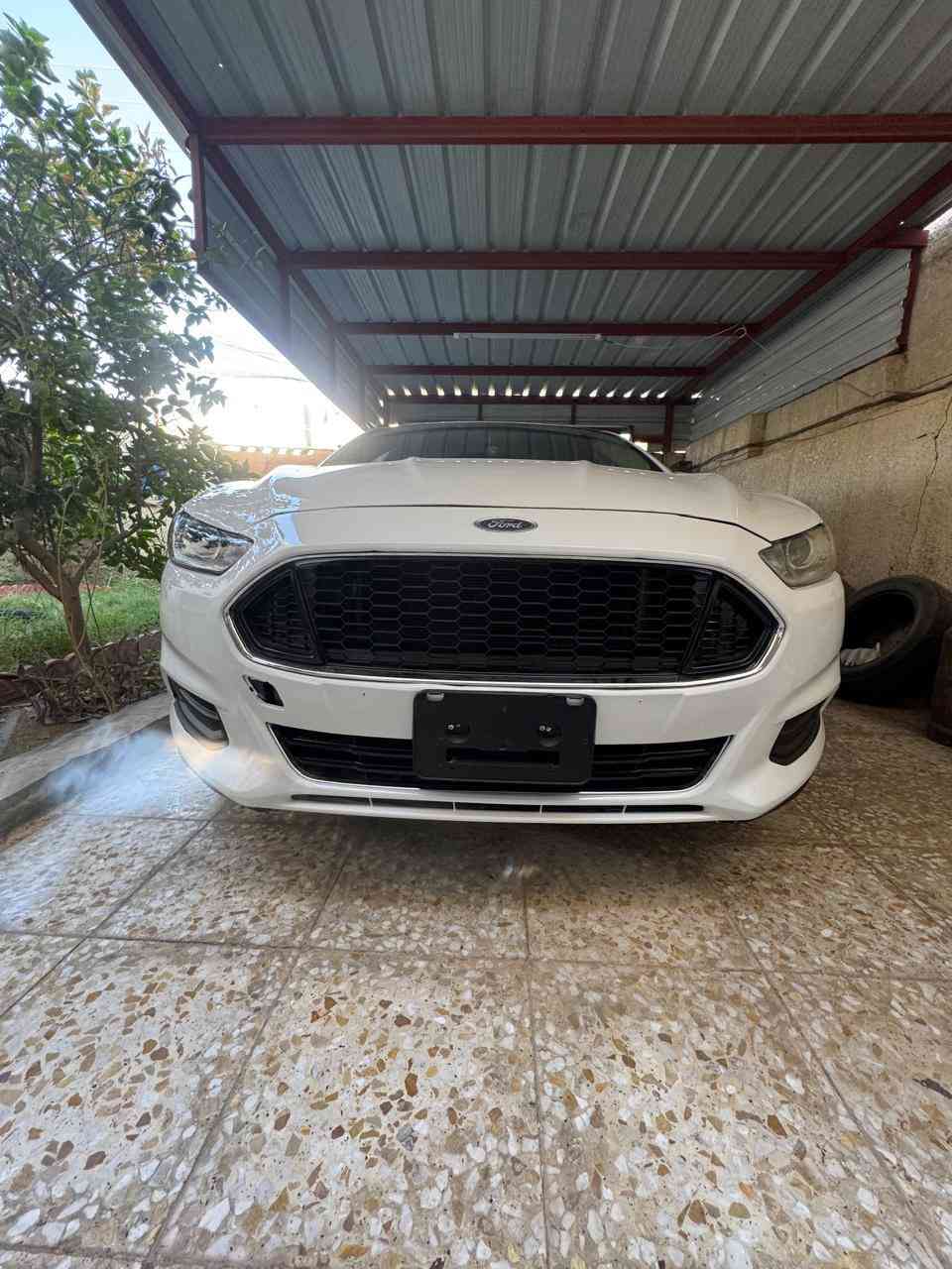 فورد فيوجن موديل 2013  محرك 2500 تنفس طبيعي اللون ابيض بغداد الصور المرفقة نظافة السيارة جيدة الحادث الأصلي دعامية جهة المعاكسة للسائق ومبدل الدعامية مع صبغ طرف البنيد وأجزاء اخرى نتيجة شخطات الشواصي واللغود سليمة السيارة موجدة ببغداد للتواصل (***********) اتصال فقط واتساب او رقم ، السعر 95 ورقة بيها مجال بسيط
