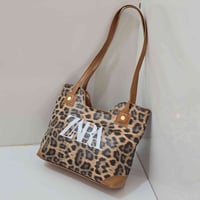 حقائب نسائية • اسود نمري • مسيب بابل