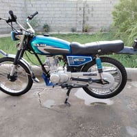 دراجة نارية • أوراق أصلية • طوريج