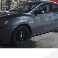 سيارة نيسان سنترا 18 للبيع حادثها في بغداد جهة اليمنة تخم تاير جديد وي...