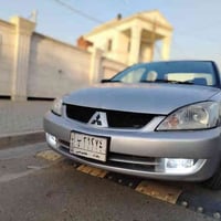 لانسر موديل 2007 محرك 2000 بيها قطع صبغ ابيع احزام تدفئة تبريد مي أخضر...