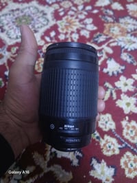 زوم نيكون • عدسة ٧٠-٣٠٠ • توصيل بغداد